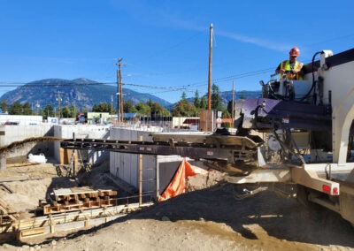 Stone Slinger Truck Unloading at Construction Site 2